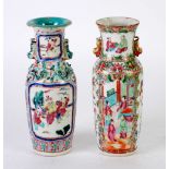 TWO LATE NINETEENTH CENTURY CHINESE CANTON VASES, with animal handles, decorated with four