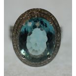 AQUAMARINE AND DIAMOND SET RING, large oval mixed cut aquamarine, approx. 10ct, with two row diamond