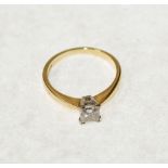 18ct GOLD RING, WITH A PRINCESS CUT SOLITAIRE DIAMOND, 0.56ct in a four claw setting, clarity SI