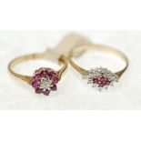 A 9ct GOLD CLUSTER RING, the tiny central diamond within a surround of eight ruby coloured stones,