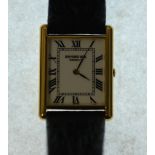 GENT'S RAYMOND WEIL QUARTZ WRIST WATCH, white roman dial with gold plated rectangular case, on black