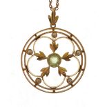 EDWARDIAN PERIDOT AND SEED PEARL SET OPENWORK PENDANT, bezel set with central round mixed cut