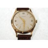 GENT'S 9CT GOLD CASED GARRARD WRIST WATCH, 17 jewel movement, silvered arabic and baton dial with