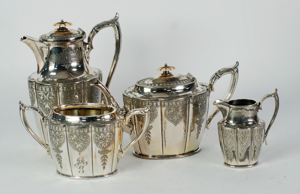 ELECTROPLATED TWO HANDLED TEA SERVICE, panelled form with bright cut engraved decoration