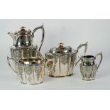 ELECTROPLATED TWO HANDLED TEA SERVICE, panelled form with bright cut engraved decoration