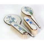 SILVER AND WHITE GUILLOCHE ENAMEL FLORAL PAINTED FOUR PIECE DRESSING TABLE SET, painted with irises,
