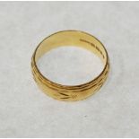 22CT GOLD BROAD WEDDING BAND, engraved decoration, size S, London 1970, 6.3g