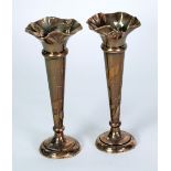 PAIR OF EDWARDIAN SILVER TRUMPET VASES, with wavy rims, knopped tapering stems and weighted circular