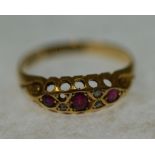 EDWARDIAN 18CT GOLD, RUBY AND DIAMOND SET RING, boat shaped top set with three graduated rubies