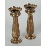 PAIR OF ARTS AND CRAFTS STYLE TRUMPET VASES, with petal shaped cup tops and fluted tapering stems,