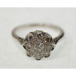 NINE STONE DIAMOND CLUSTER RING, 0.31ct approx. total carat weight, plain platinum band, size K,