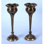 PAIR OF EDWARDIAN SILVER TRUMPET VASES, with tulip tops and knopped tapering tall stems, on