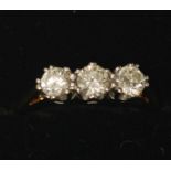 THREE STONE DIAMOND RING, 0.75ct approx. total carat weight, plain 18ct gold band, size K ½,