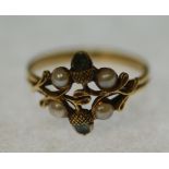 EDWARDIAN TSAVORITE GARNET AND SEED PEARL ACORN PATTERN RING, with two tsavorite set acorns