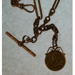 9CT GOLD FANCY LONG AND SHORT CHAIN ALBERT with two clips and t-bar, SUSPENDING A GEORGE V, 1913,