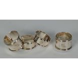 TWO PAIRS OF SILVER NAPKIN RINGS, one pair with castellated borders, Birmingham 1945, the other pair