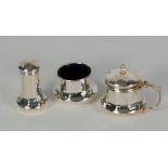 THREE PIECE SILVER CONDIMENT SET, bulbous panelled form, with blue glass liners, Birmingham 1930,