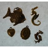 18CT GOLD ENAMELLED SEAHORSE CHARM, 1.4g A 9CT GOLD LARGE FISH CHARM, with red paste set eyes, A 9CT