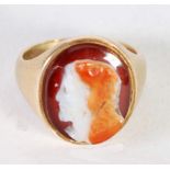 18ct GOLD RING, set with an oval sardonyx carved cameo, depicting a bearded classical head, engraved