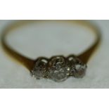 THREE STONE DIAMOND RING, 0.42ct approx. total carat weight, to the plain stamped 18ct gold band,
