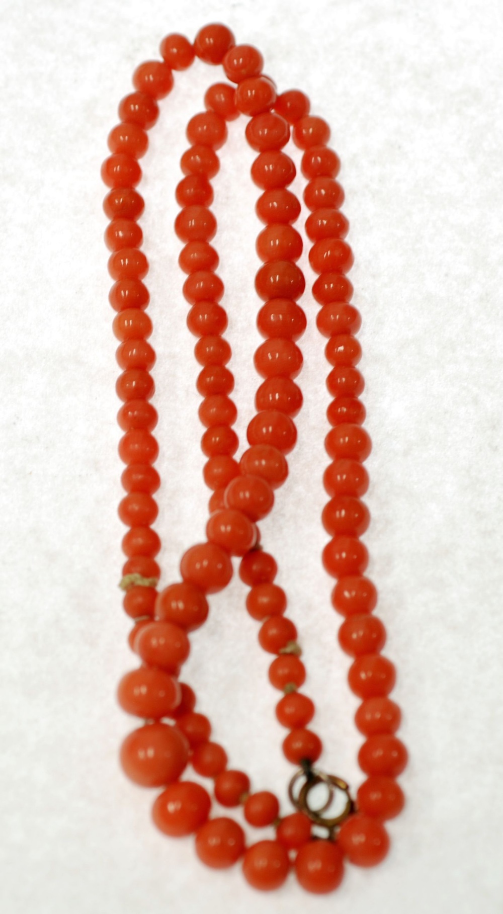 GRADUATED CORAL BEAD NECKLACE, formed of 95 off round graduated coral beads, 4.8mm-8.4mm diameter,