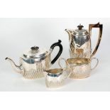 VICTORIAN SILVER FOUR PIECE BACHELOR TEA AND COFFEE SET, wrythen fluted decoration, with wood