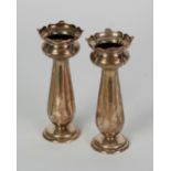 PAIR OF EDWARDIAN SILVER TRUMPET VASES, with tulip tops and flued tapering stems, on circular bases,