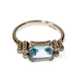 AN 18ct WHITE GOLD EMERALD-CUT AQUAMARINE AND TINY DIAMOND SET RING, 4.8 gms gross