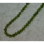 PERIDOT BEAD NECKLACE, PAIR OF PERIDOT AND SILVER STUD EARRINGS, A PLATED GATE LINK BRACELET AND