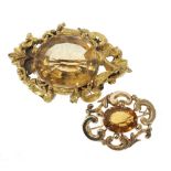 A LATE VICTORIAN CITRINE SET SCROLLIATED BROOCH, and a LARGE CITRINE SET BROOCH in gilt metal