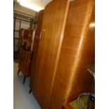 A MID TWENTIETH CENTURY RETRO BEDROOM SUITE OF DOUBLE WARDROBE, SUNK CENTRE DRESSING TABLE WITH