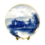 VICTORIAN COPELAND POTTERY WALL PLAQUE, painted in blue monochrome with named view of Tintern Abbey,