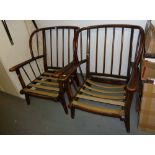 A PAIR OF DARK WOOD ERCOL FIRESIDE ARMCHAIRS, WITH STICK BACK SIDES (2)