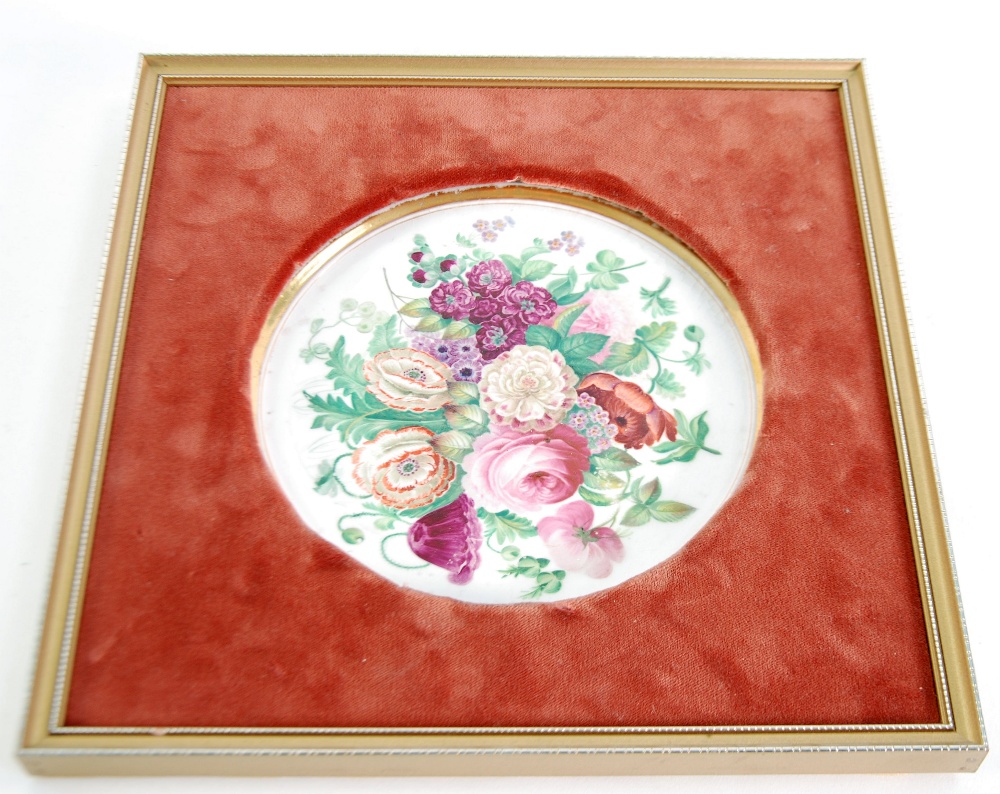 PAIR OF WHITE PORCELAIN CIRCULAR WALL PLAQUES, one painted with a bouquet of summer flowers, the