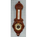 EARLY 20th CENTURY CARVED OAK BANJO CASED ANEROID BAROMETER, with thermometer to the trunk, 22" (