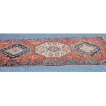 ANTIQUE N.W. PERSIA/CAUCASIAN WOLL PILE RUG, the brick red field with three medallions within a