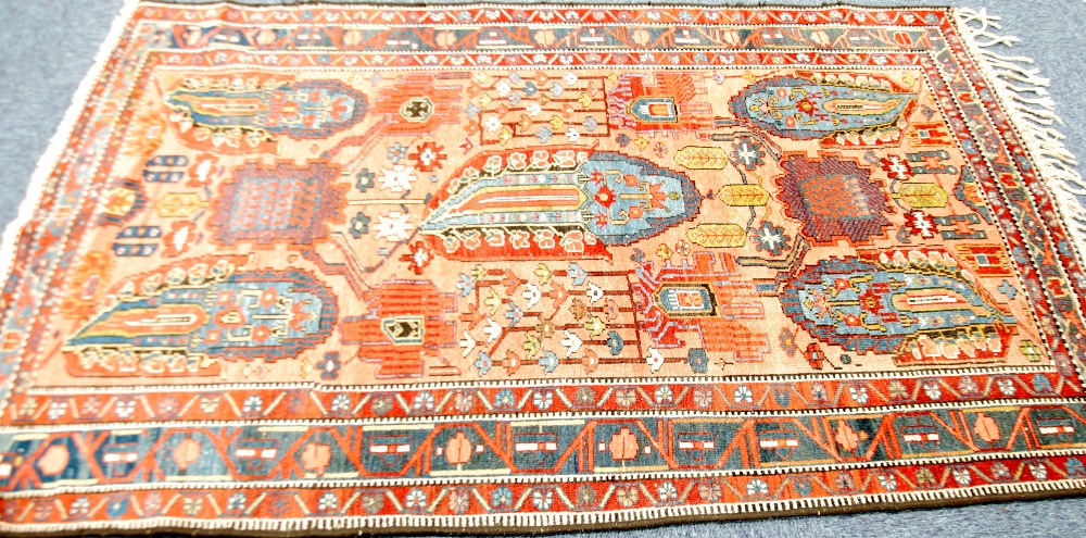 TWENTIETH CENTURY BIJAR RUG, with five large Tooteh shapes, stylised flowering shrubs and