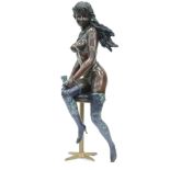 MODERN BRONZE MODEL OF A NAKED FEMALE FIGURE seated on a bar stool, 24" (61cm) high