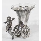 AN EARLY 1900's WMF SILVER PLATED PEWTER CORNUCOPIA FORM WHEELED FLOWER VASE, with cut glass