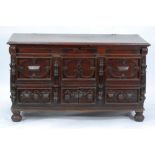 EIGHTEENTH CENTURY CONTINENTAL CARVED OAK DOWER CHEST, the moulded oblong top above a three panelled