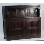 LATE SEVENTEENTH CENTURY CARVED OAK COURT CUPBOARD, the carved frieze above a pair of free