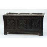 18th CENTURY CARVED OAK COFFER, the three panel top above a three panel front, later carved with