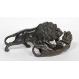 SMALL JAPANESE MEIJI PERIOD BRONZE PATINATED COPPER ALLOY MODEL OF A LION PINNING DOWN A TIGER IN