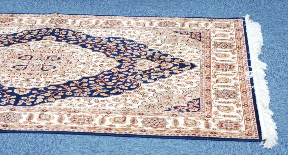 MODERN MACHINE MADE EASTERN RUG ON BLUE GROUND, 55" x 75" - Image 2 of 2