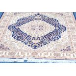 MODERN MACHINE MADE EASTERN RUG ON BLUE GROUND, 55" x 75"