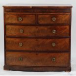GEORGE III FIGURED MAHOGANY BOW FRONTED CHEST OF DRAWERS, the crossbanded top above a flame cut