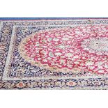 MODERN MACHINE MADE EASTERN CARPET ON RED GROUND, 79" x 107 ½"