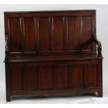 LATE 18th CENTURY PANELLED OAK SETTLE OF TYPICAL FORM, with six panel back, downswept scroll arms,