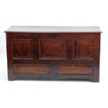 EIGHTEENTH CENTURY CROSSBANDED OAK COFFER, the moulded oblong top above a three panelled front