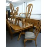 A MODERN DINING ROOM SUITE OF EXTENDING DINING TABLE, EIGHT CHAIRS AND A SIDEBOARD